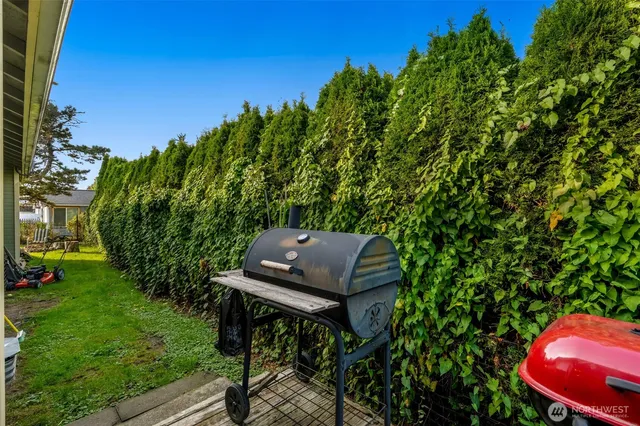 a view of a backyard with sitting area