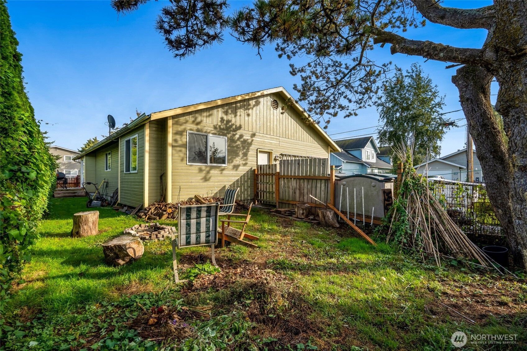 319 6th Street Blaine, WA 98230 - Photo 20 of 24 a view of a chair and table in backyard of the house