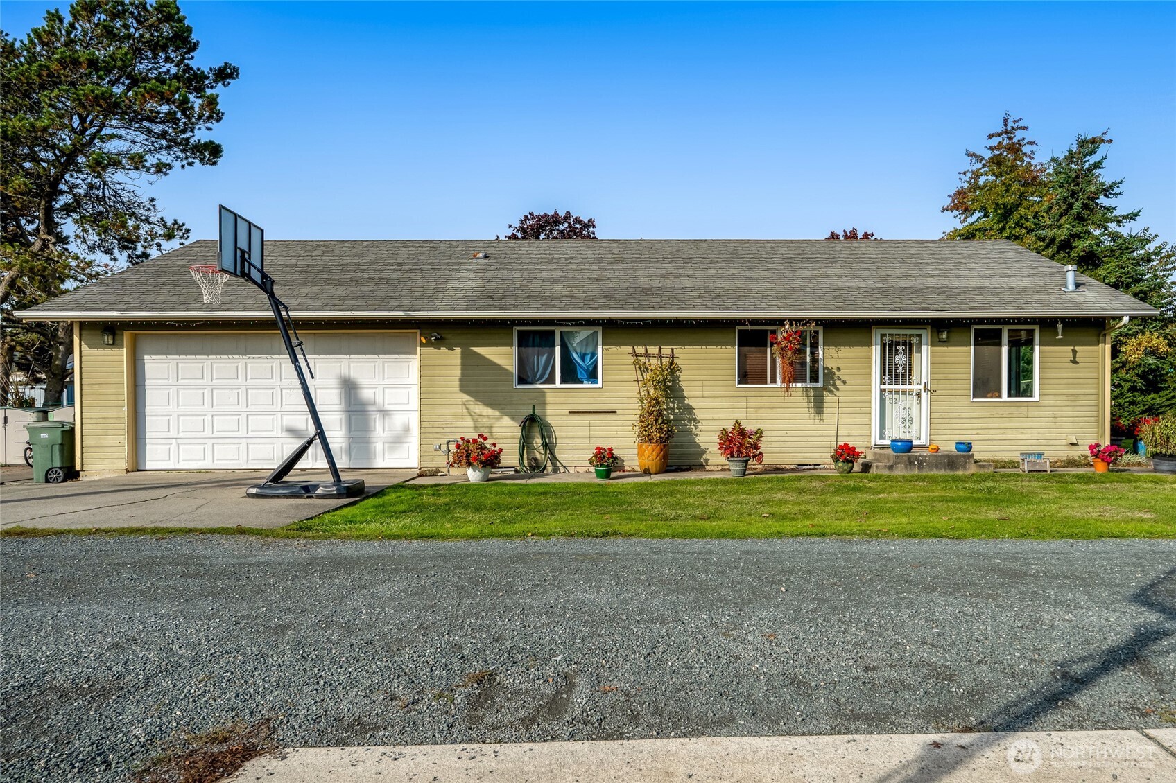 319 6th Street Blaine, WA 98230 - Photo 2 of 24 a front view of a house with a yard and garage