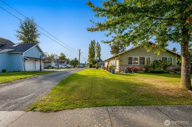a front view of house with yard and green space