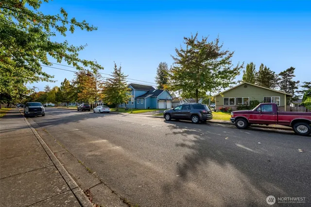a view of street with parked cars