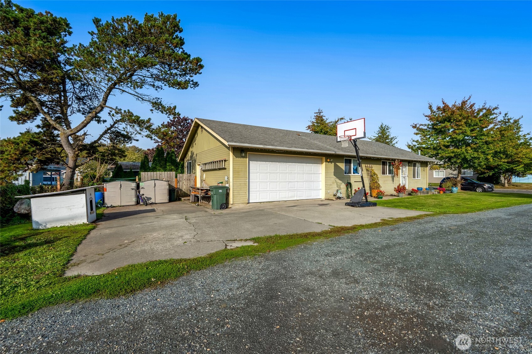 319 6th Street Blaine, WA 98230 - Photo 3 of 24 a view of a house with a yard and garage