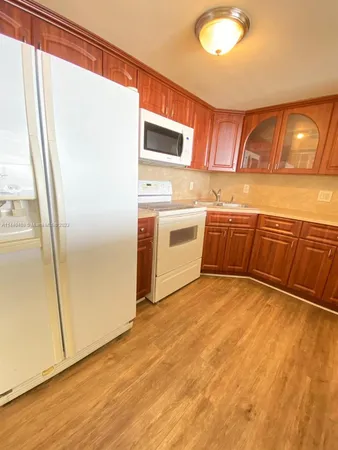 a view of a kitchen with a sink