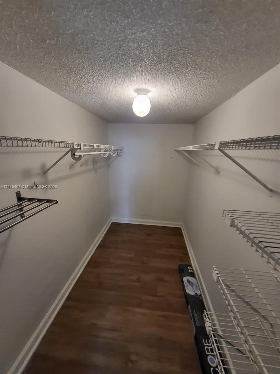 13499 Biscayne Boulevard, Unit 1408 North Miami, FL 33181 - Photo 19 of 24 a view of a hallway with wooden floor