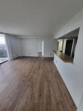 a view of a livingroom with wooden floor