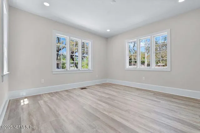 a kitchen with stainless steel appliances a refrigerator sink and stove top oven