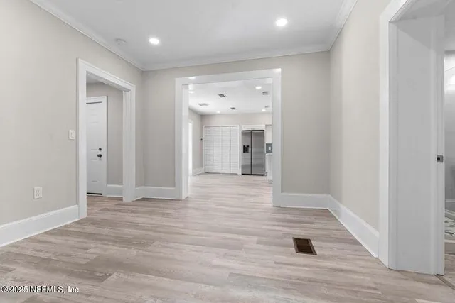 a kitchen with kitchen island granite countertop white cabinets and white appliances