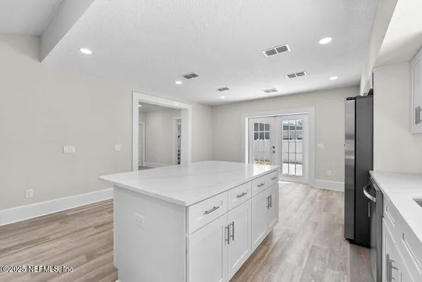 a view of staircase with wooden floor and a rug