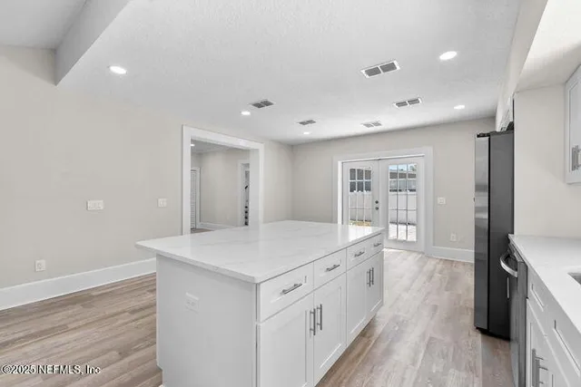a view of staircase with wooden floor and a rug
