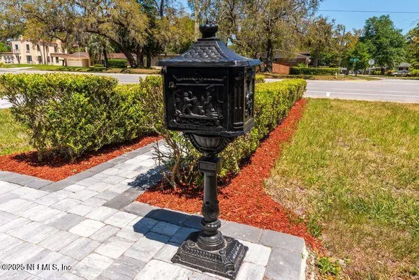 a view of house with yard outdoor seating and barbeque oven