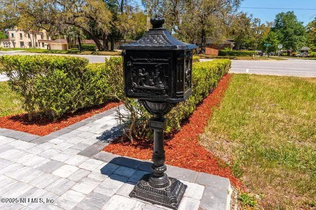 a view of house with yard outdoor seating and barbeque oven