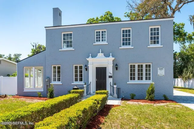 a view of front door of house with yard