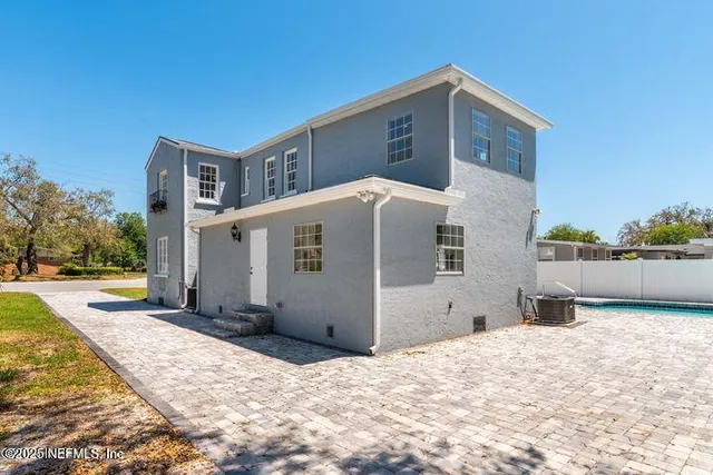 a kitchen with stainless steel appliances a refrigerator sink and cabinets