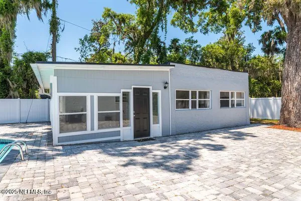 a kitchen with a refrigerator stove and sink