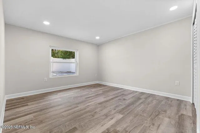 an aerial view of a house with a swimming pool