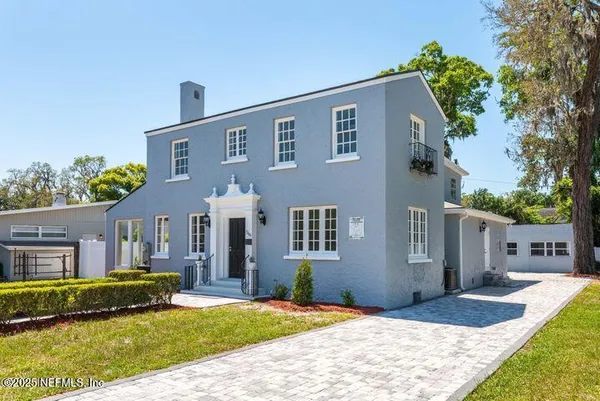 an aerial view of a house with outdoor space