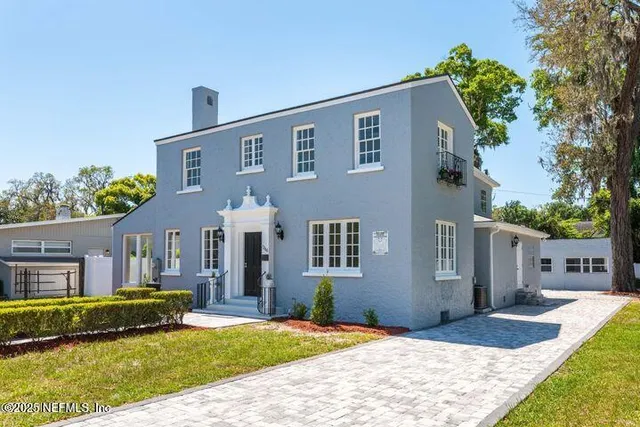 an aerial view of a house with outdoor space