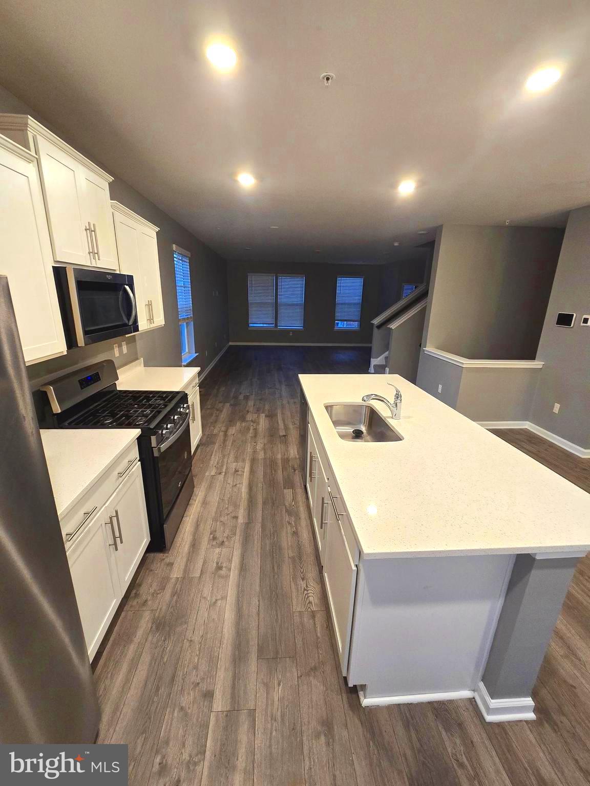 2118 Ruby Turn Bowie, MD 20721 - Photo 3 of 24 a open kitchen with kitchen island a stove and a sink