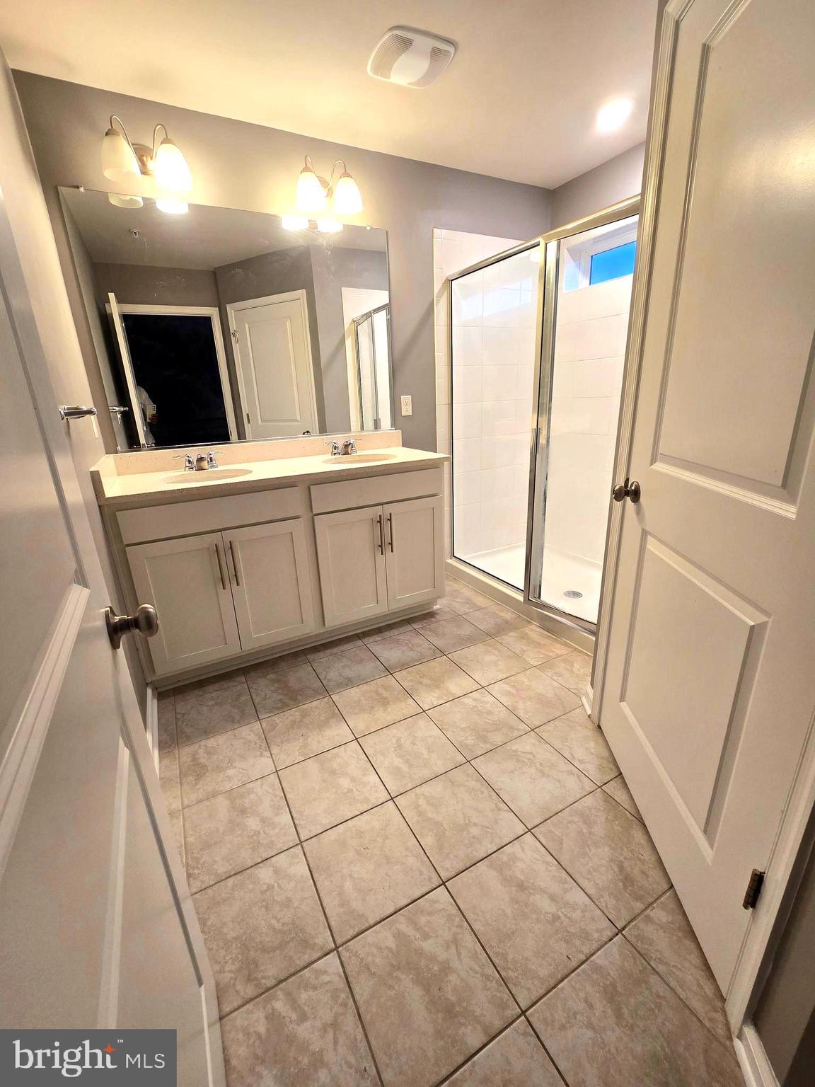 2118 Ruby Turn Bowie, MD 20721 - Photo 4 of 24 a bathroom with a sink a mirror and a shower