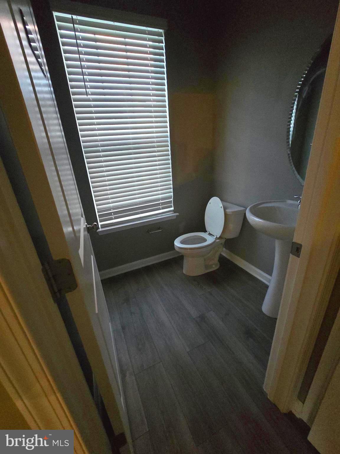 2118 Ruby Turn Bowie, MD 20721 - Photo 9 of 24 a bathroom with a toilet and a window
