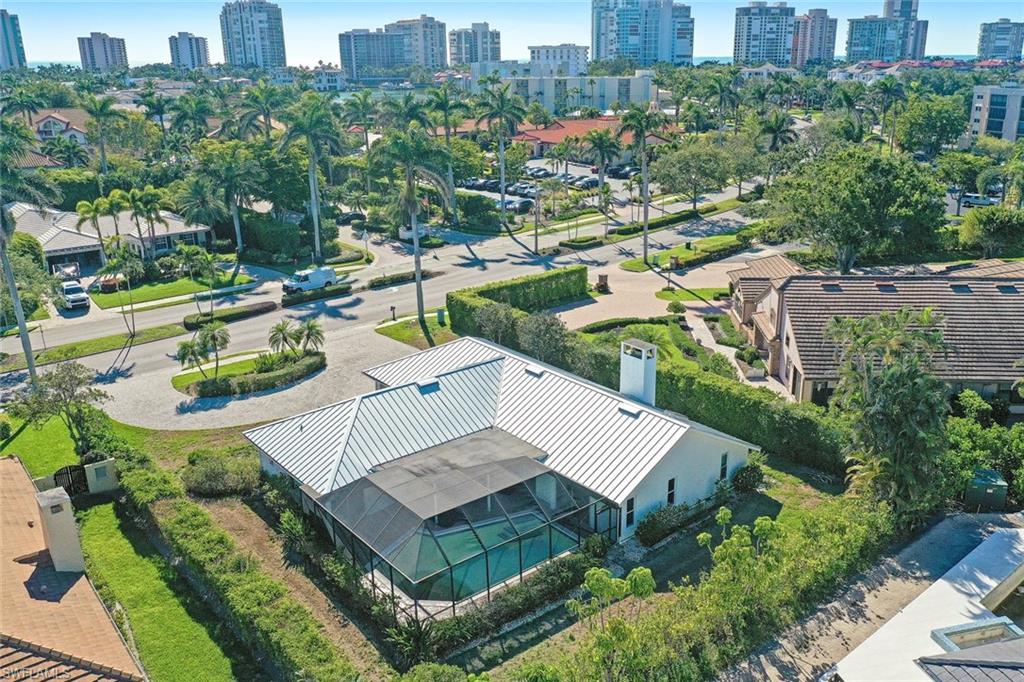 601 Park Shore Drive Naples, FL 34103 - Photo 7 of 18 an aerial view of a house with a yard patio and lake view