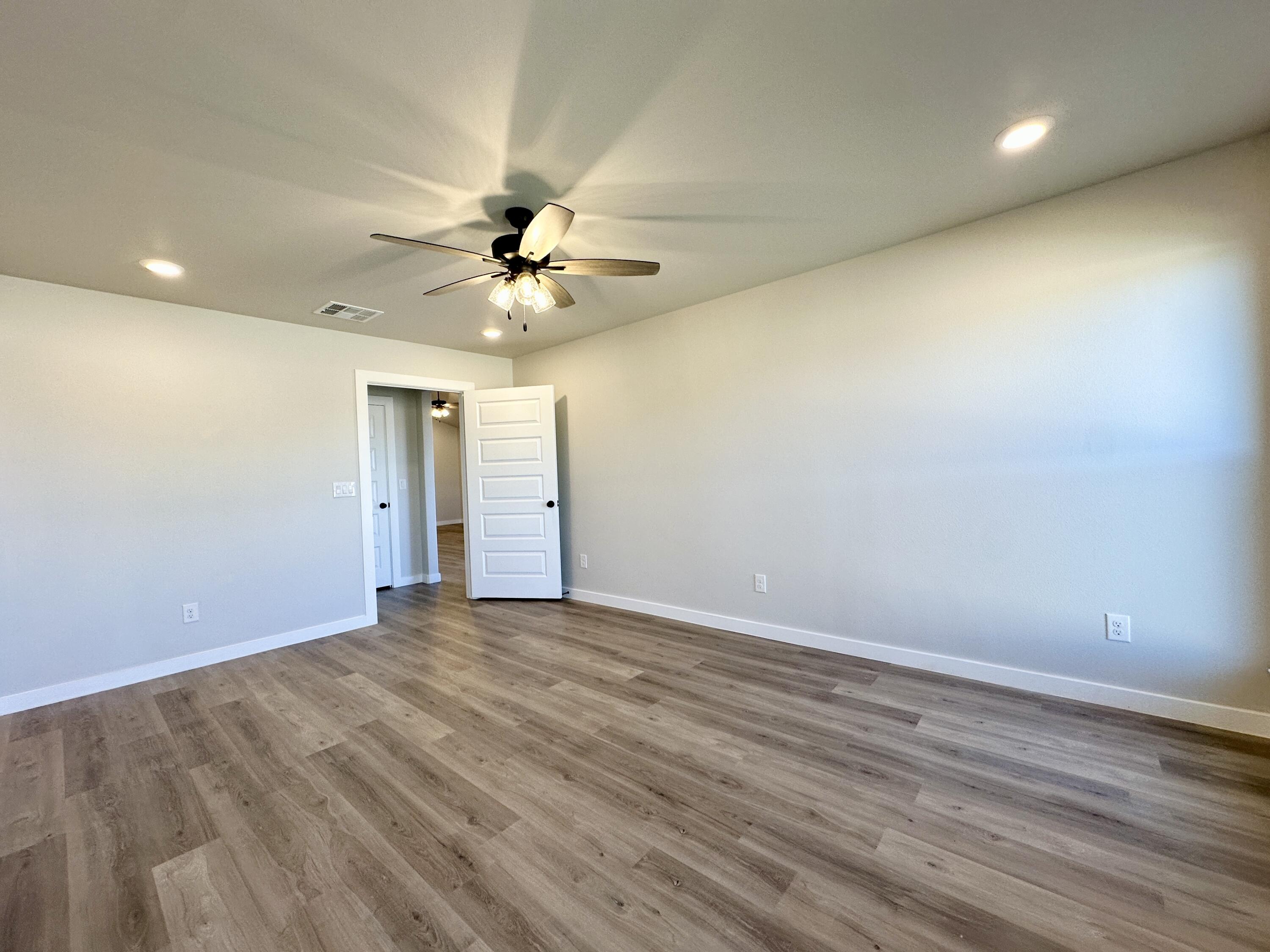 2208 134th Street Lubbock, TX 79423 - Photo 12 of 17 wooden floor in an empty room