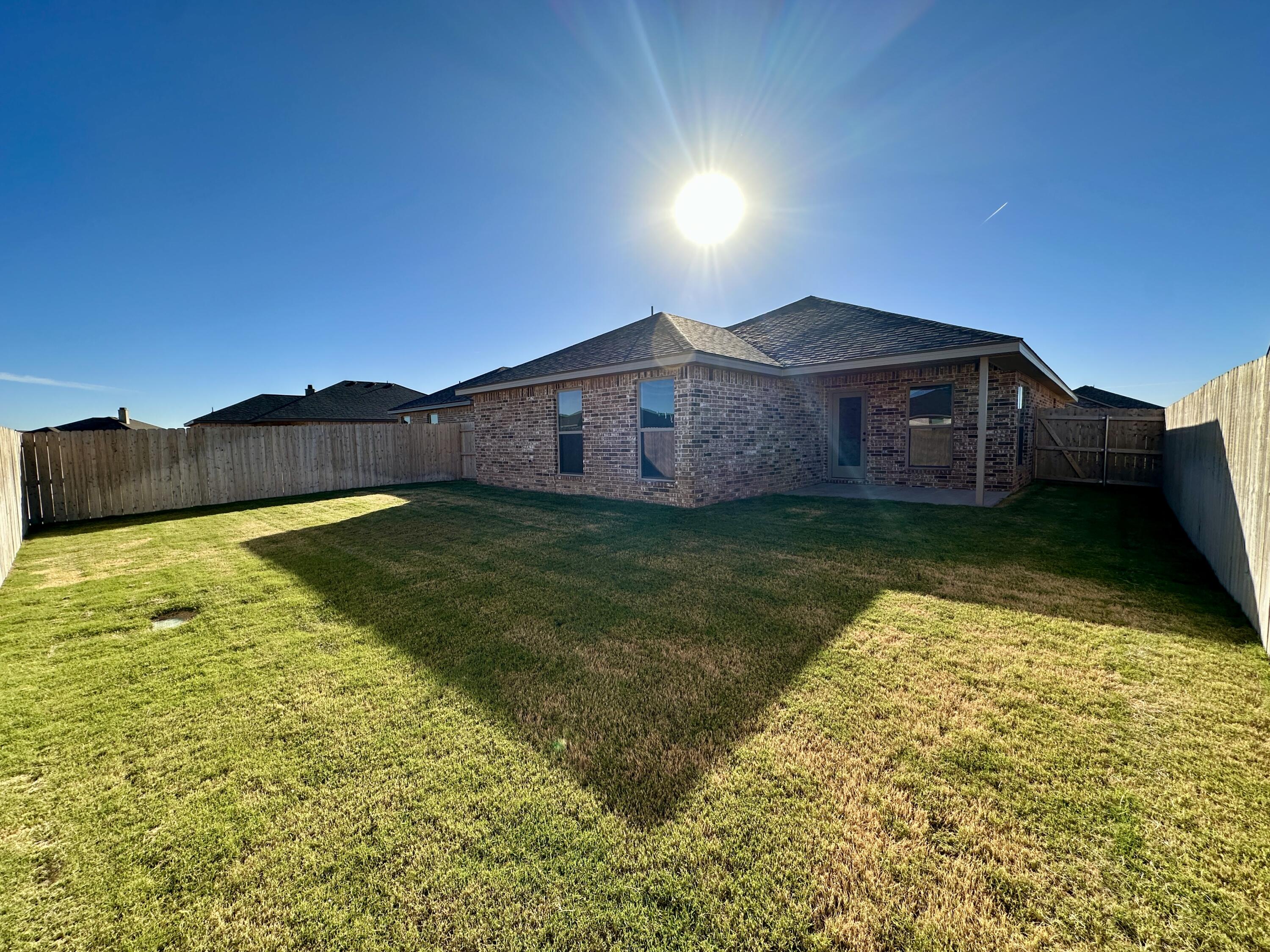 2208 134th Street Lubbock, TX 79423 - Photo 17 of 17 a view of a large pool with a yard