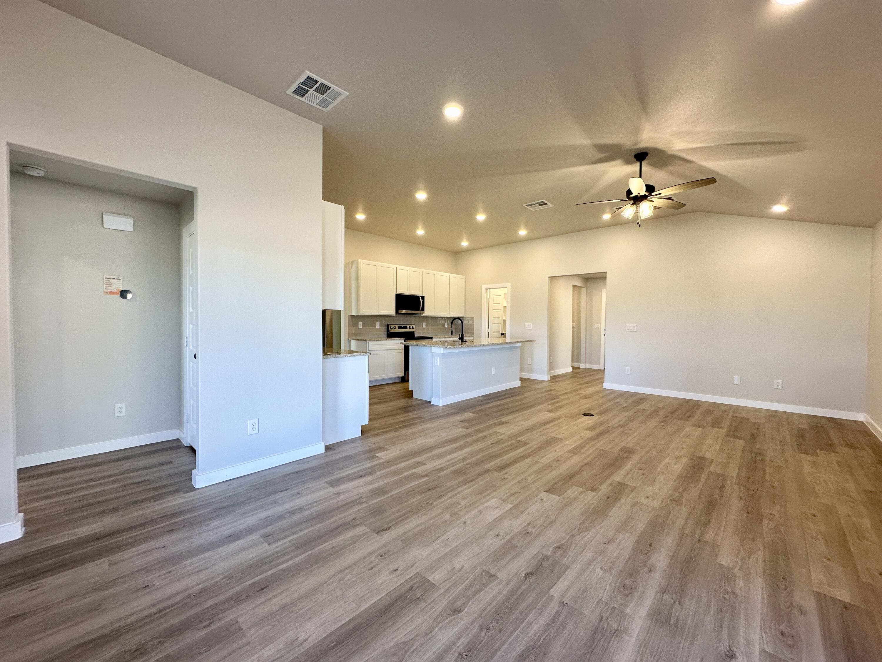 2208 134th Street Lubbock, TX 79423 - Photo 2 of 17 a view of a kitchen with a sink and a refrigerator