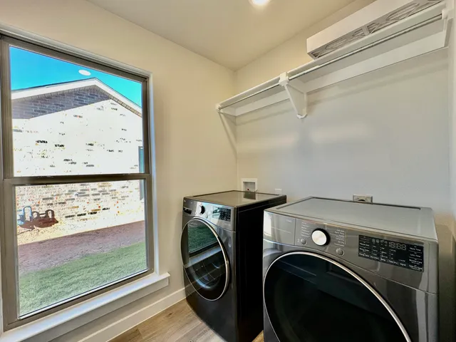 a utility room with dryer and washer