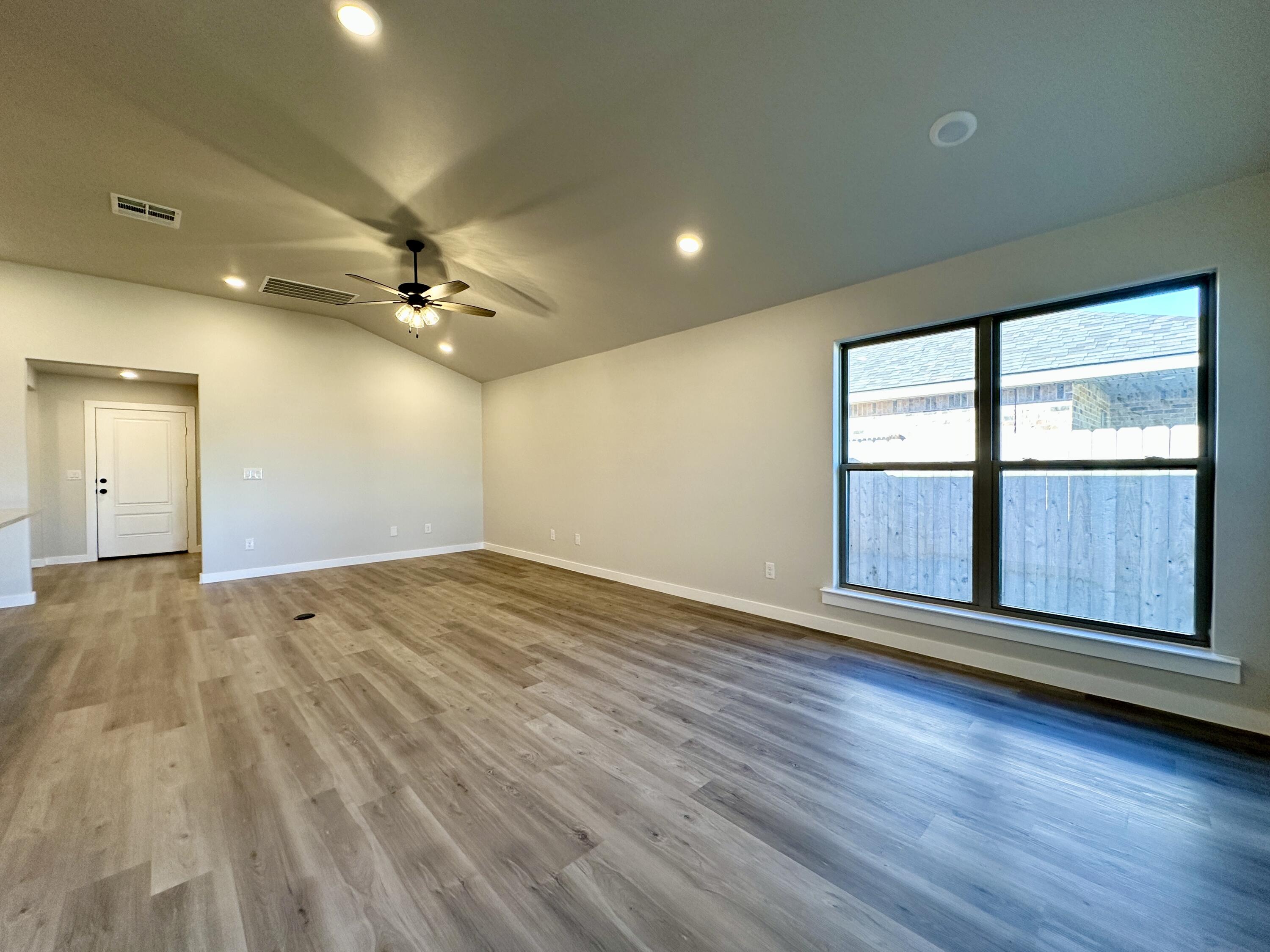 2208 134th Street Lubbock, TX 79423 - Photo 9 of 17 a view of an empty room with a window
