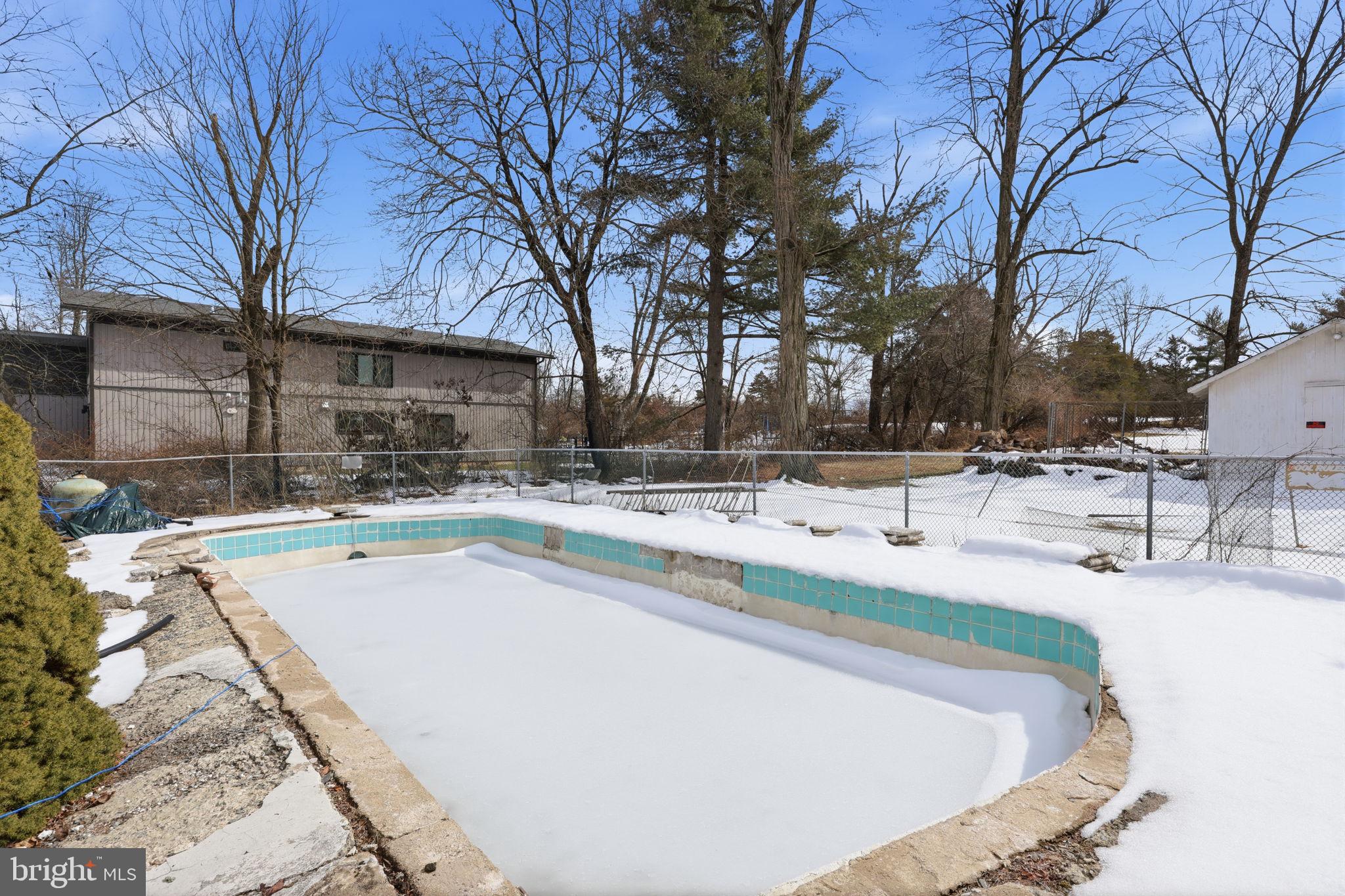 186 Pennington - Harbourton Road Pennington, NJ 08534 - Photo 6 of 20 a view of a backyard with snow on the road