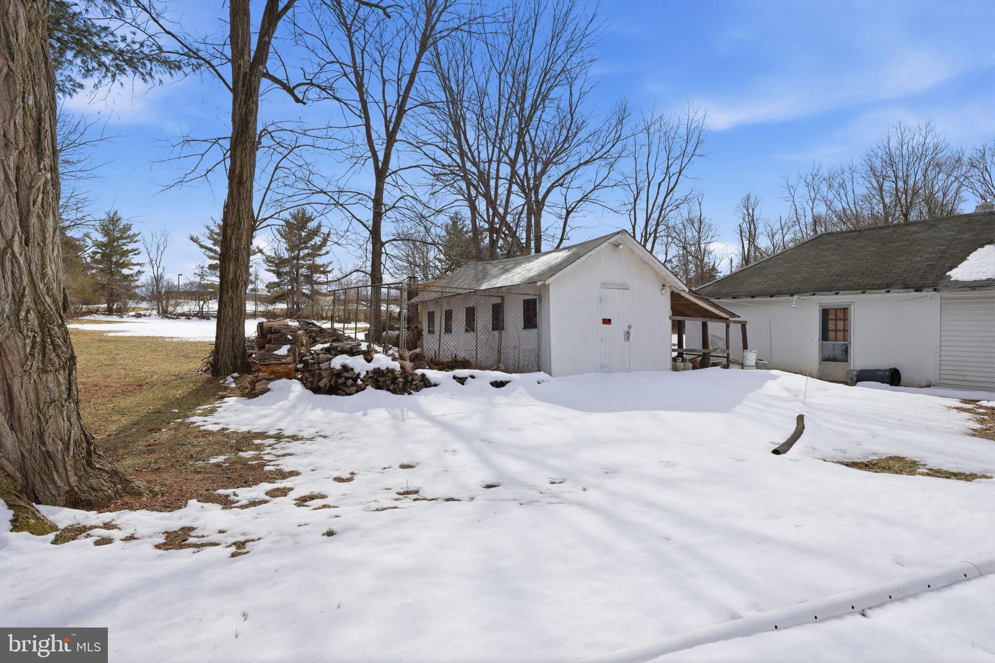 186 Pennington - Harbourton Road Pennington, NJ 08534 - Photo 8 of 20 a view of a white house covered in snow