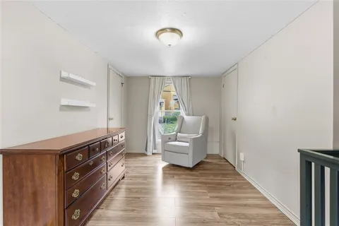 a view of a living room and wooden floor