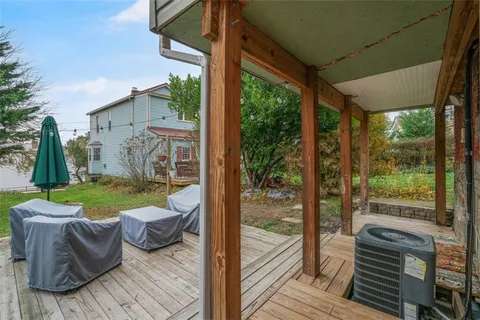 a view of a two chairs in the balcony