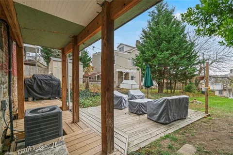 a view of balcony with couch and trees