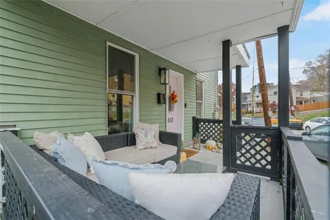 a view of a couches and dinning table in patio