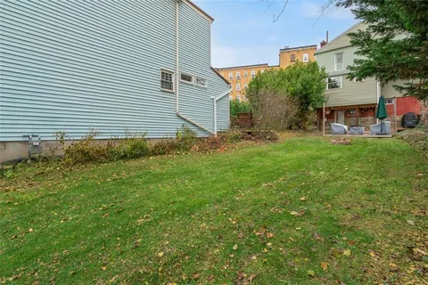 a view of a house with a backyard