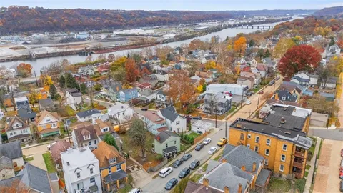 an aerial view of residential building and trees