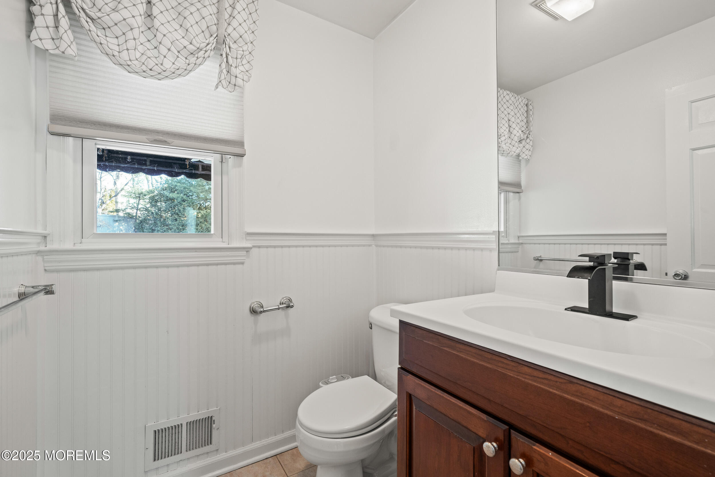 20 Arlene Drive West Long Branch, NJ 07764 - Photo 17 of 32 a bathroom with a sink a toilet and mirror