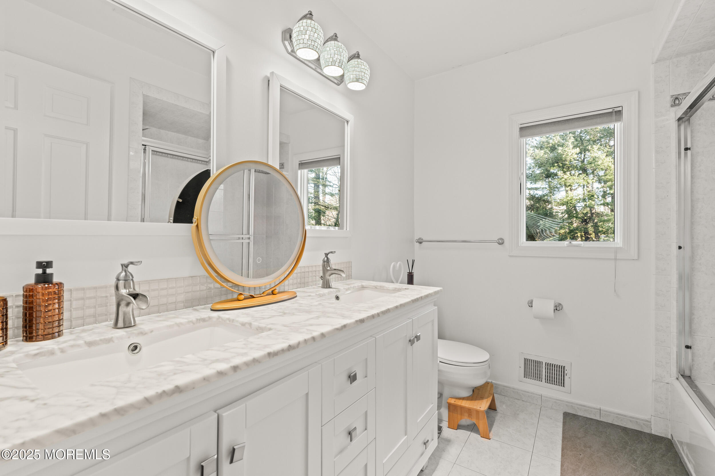 20 Arlene Drive West Long Branch, NJ 07764 - Photo 19 of 32 a bathroom with a granite countertop toilet a sink and a mirror