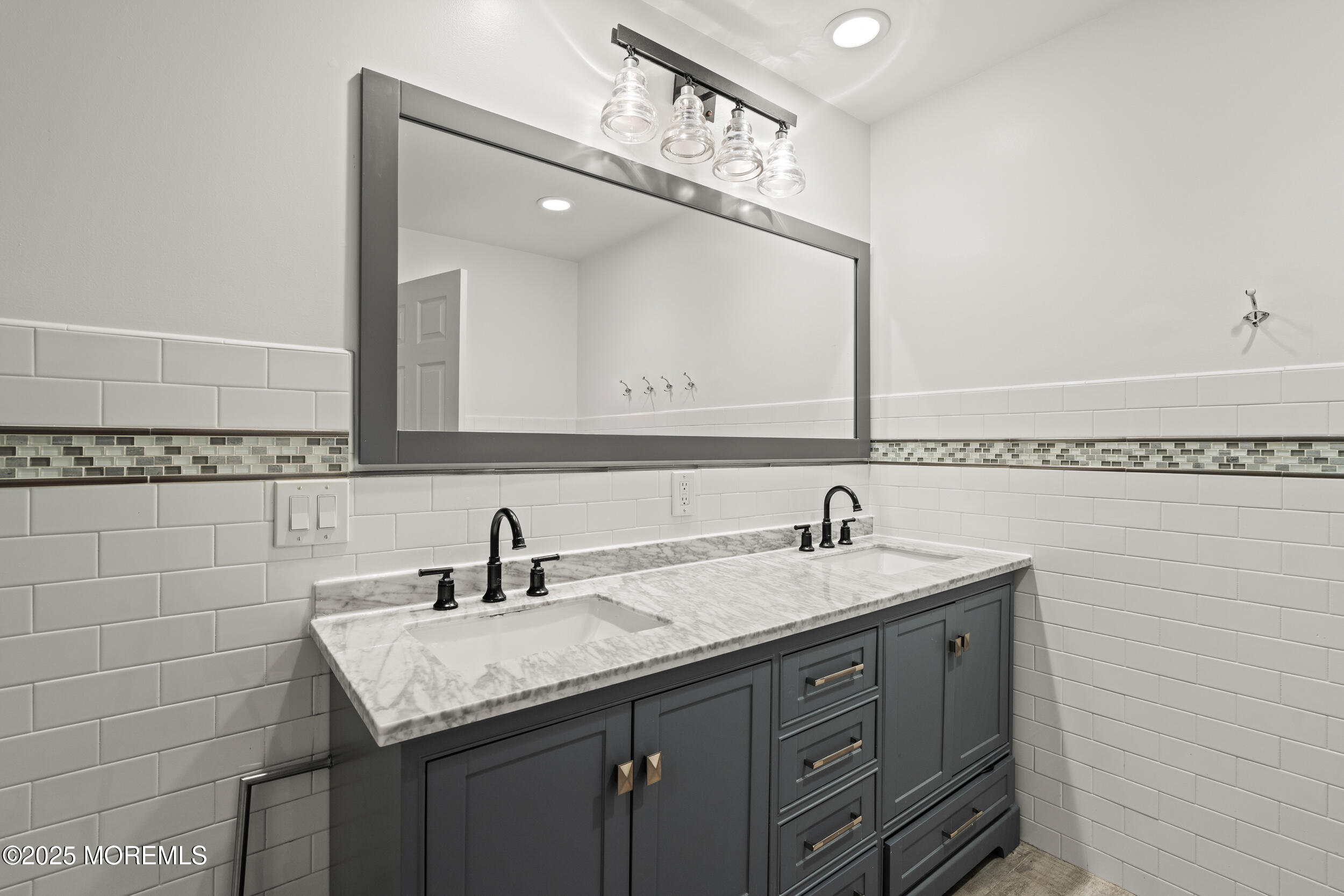 20 Arlene Drive West Long Branch, NJ 07764 - Photo 21 of 32 a bathroom with a granite countertop sink a large mirror and