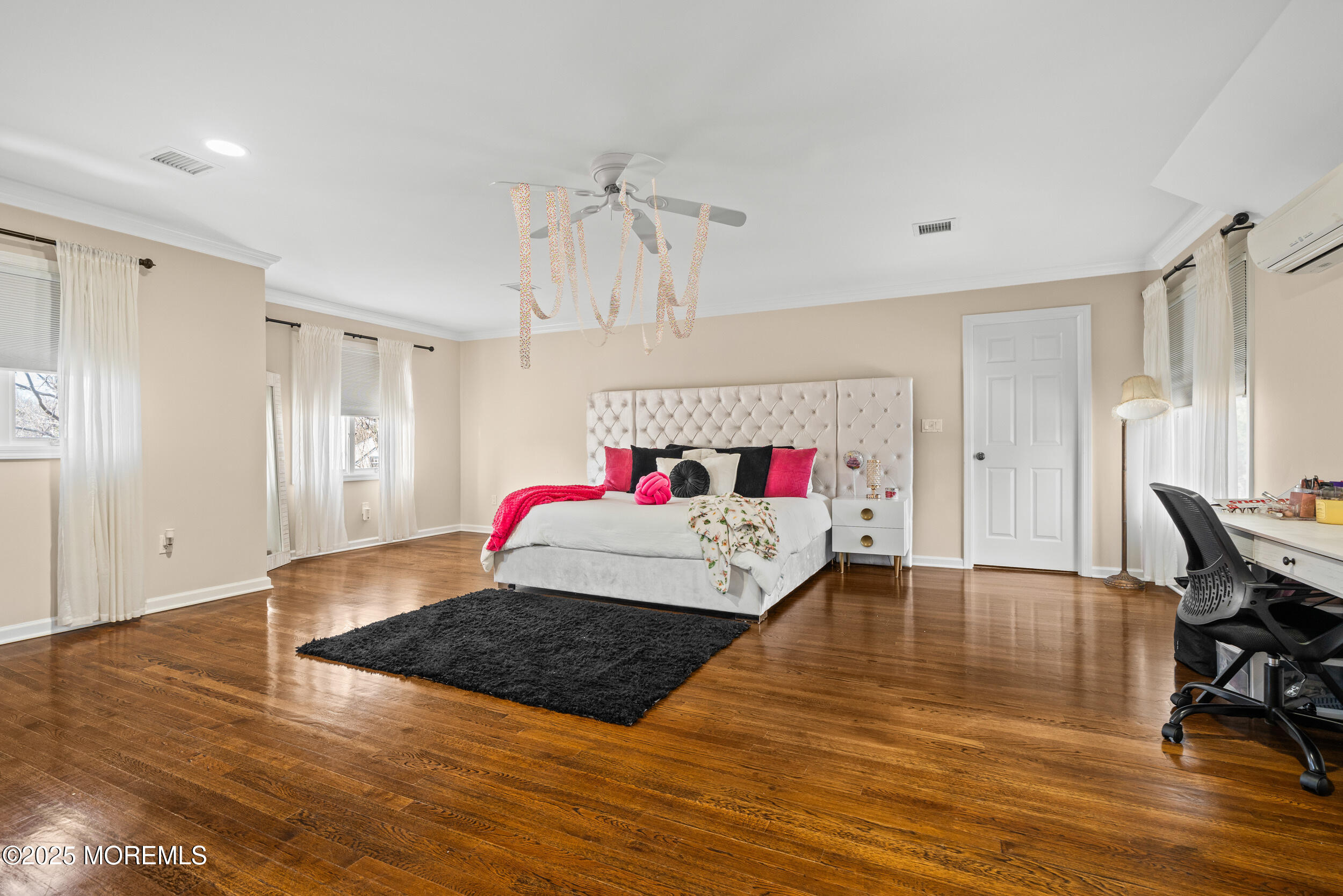 20 Arlene Drive West Long Branch, NJ 07764 - Photo 22 of 32 a spacious bedroom with a bed and a table in it