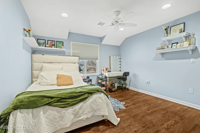 a bedroom with a bed and cabinets