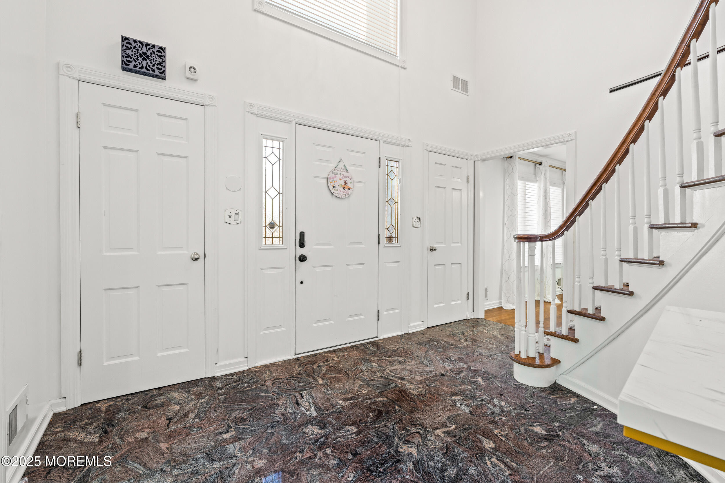 20 Arlene Drive West Long Branch, NJ 07764 - Photo 4 of 32 a view of an entryway with staircase