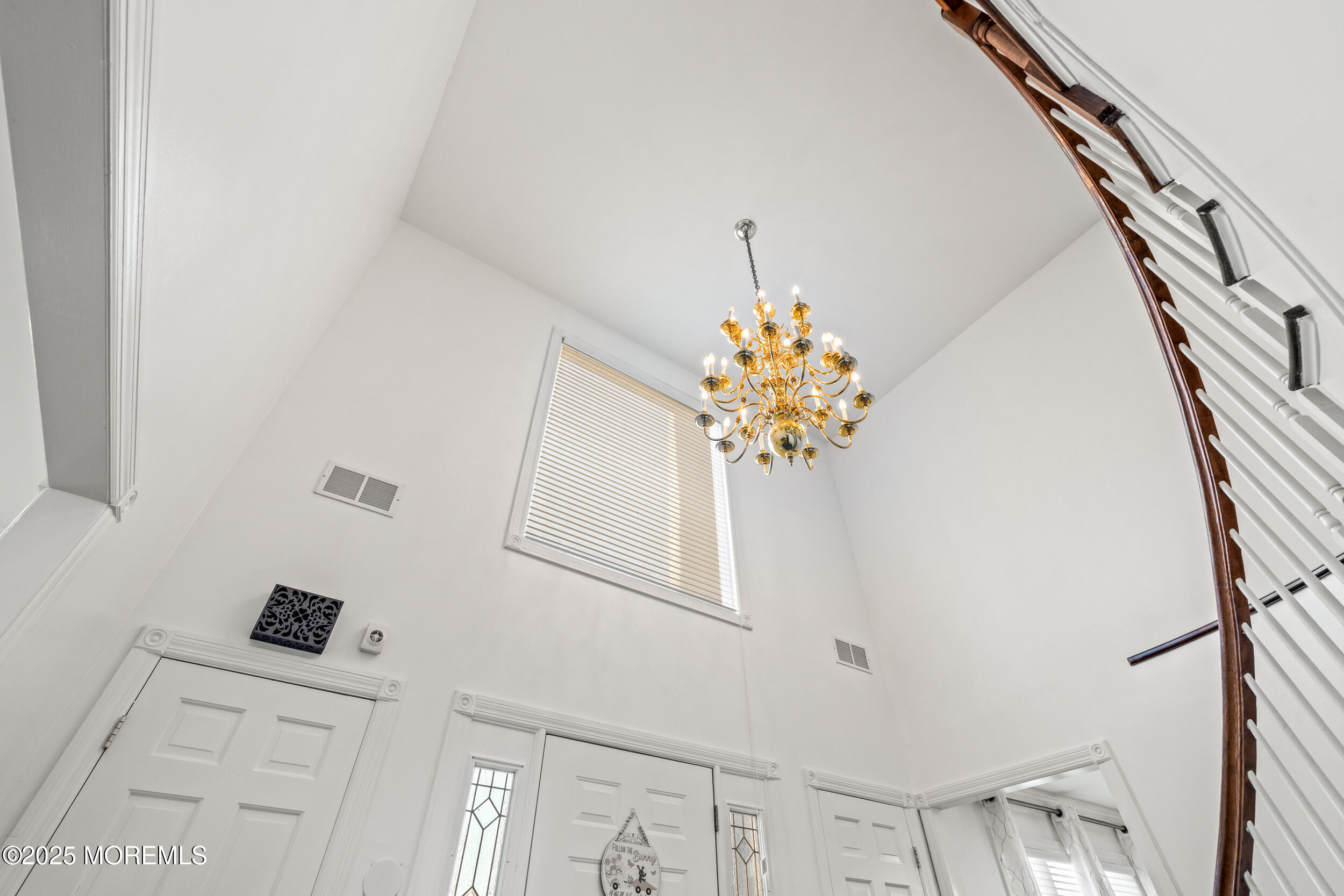 20 Arlene Drive West Long Branch, NJ 07764 - Photo 5 of 32 a view of a hallway with a chandelier