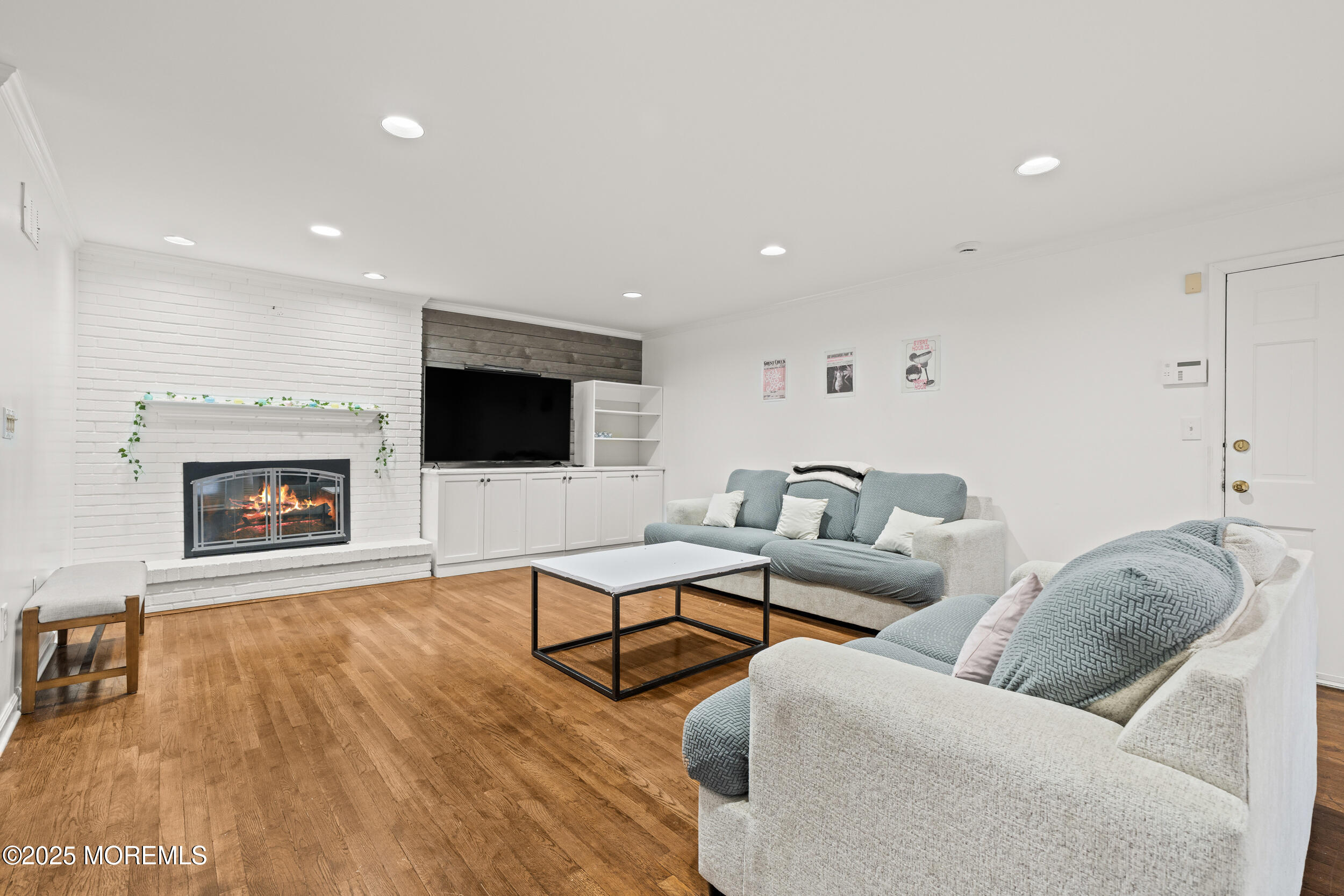 20 Arlene Drive West Long Branch, NJ 07764 - Photo 9 of 32 a living room with furniture fireplace and flat screen tv