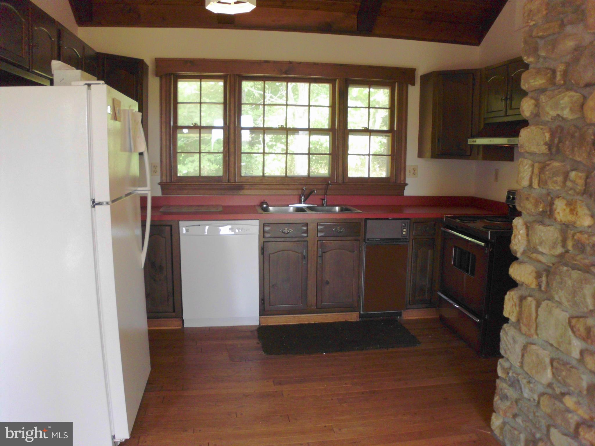 6594 Swains Road Marshall, VA 20115 - Photo 5 of 28 a kitchen with a stove and a refrigerator