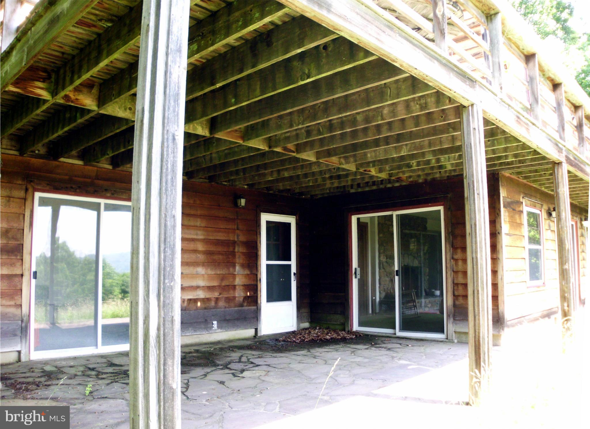 6594 Swains Road Marshall, VA 20115 - Photo 10 of 28 a view of a house with a large window and door
