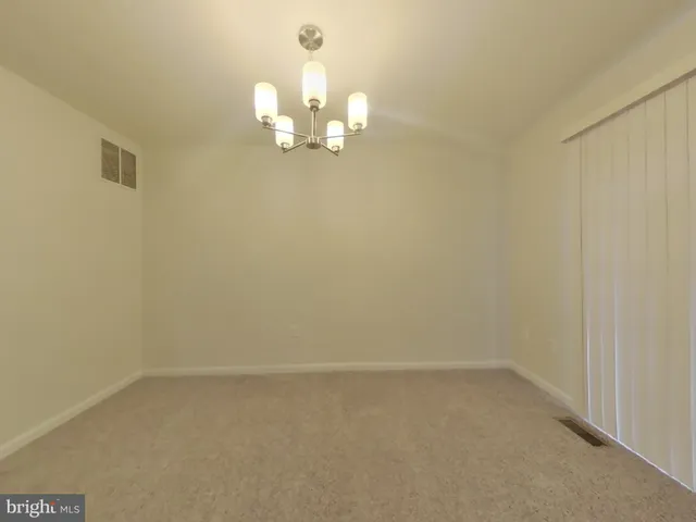a view of a chandelier in big room