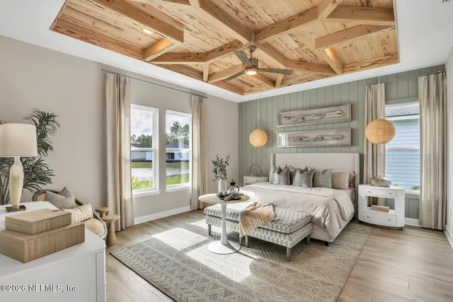 a bedroom with a bed couch and window